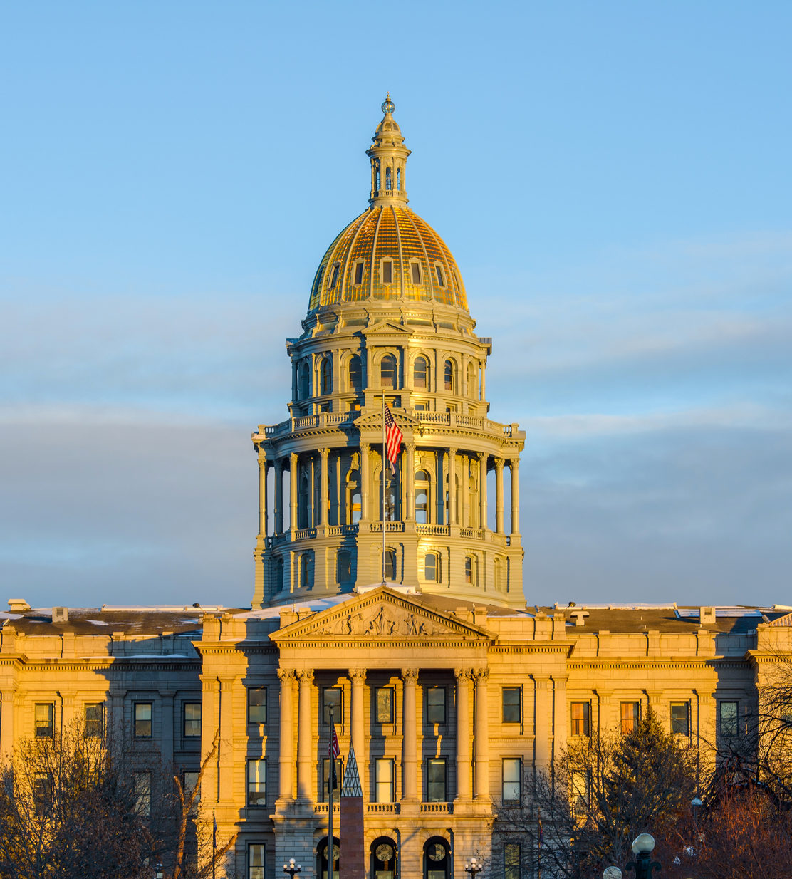 A winter sunset view of Colorado State Capitol Building in Downtown Denver.