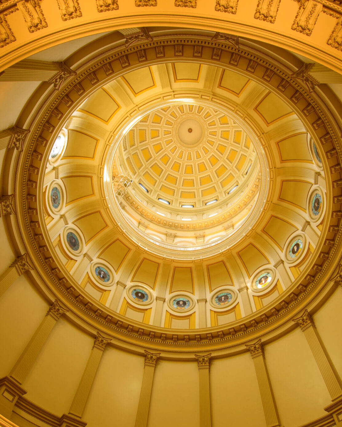 A close-up inside view of gold dome of Colorado State Capitol Building.