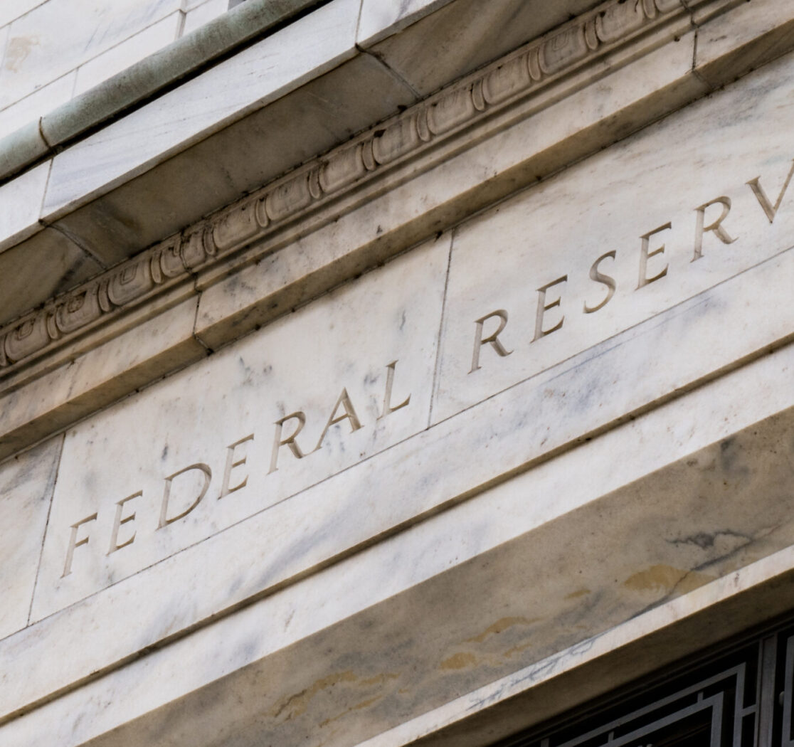 A close-up view of the facade of the Federal Reserve building in Washington, DC