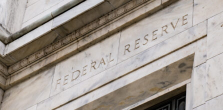 A close-up view of the facade of the Federal Reserve building in Washington, DC